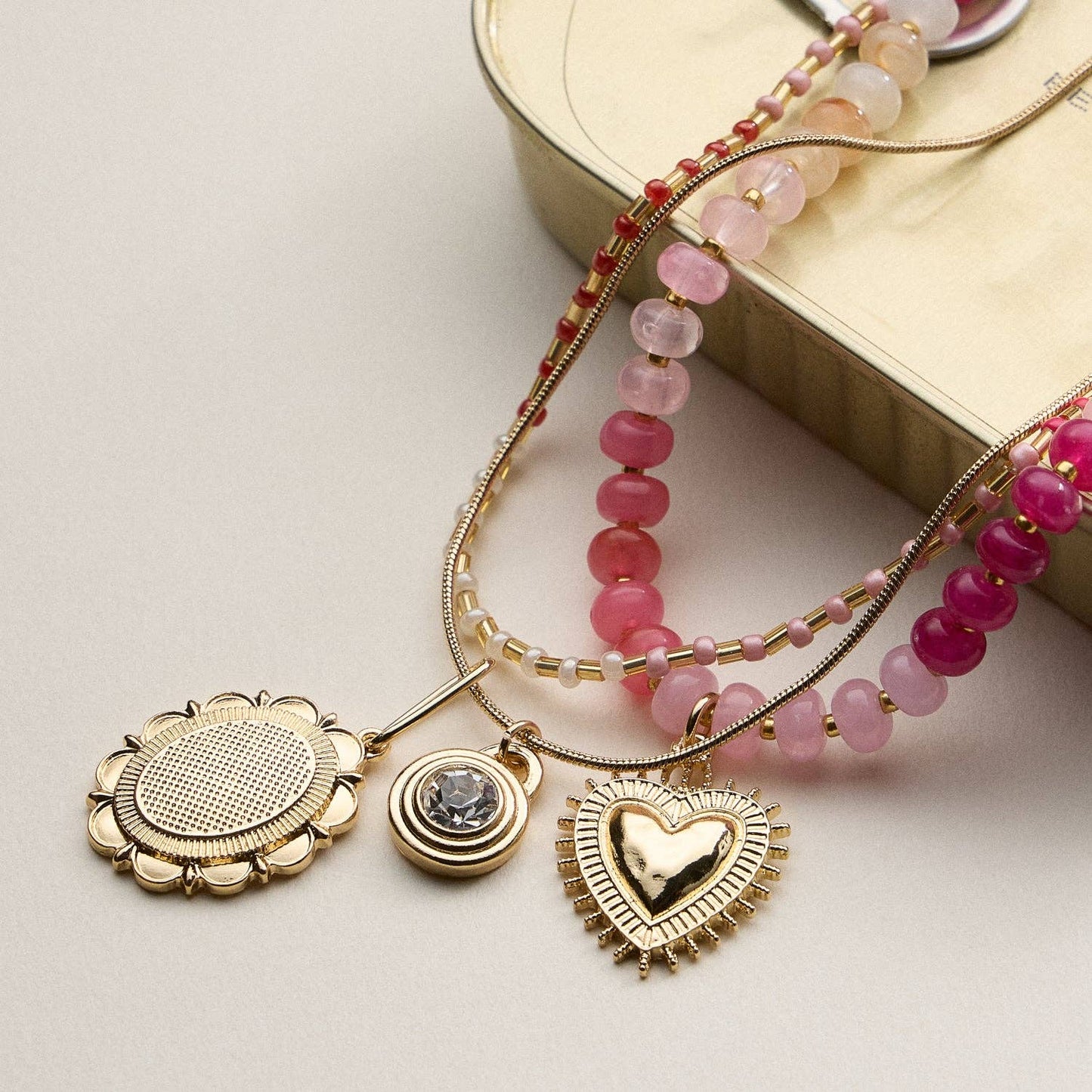 Layered Beaded and Pendant Necklace Set with Gold Accents – Heart and Charm Detail